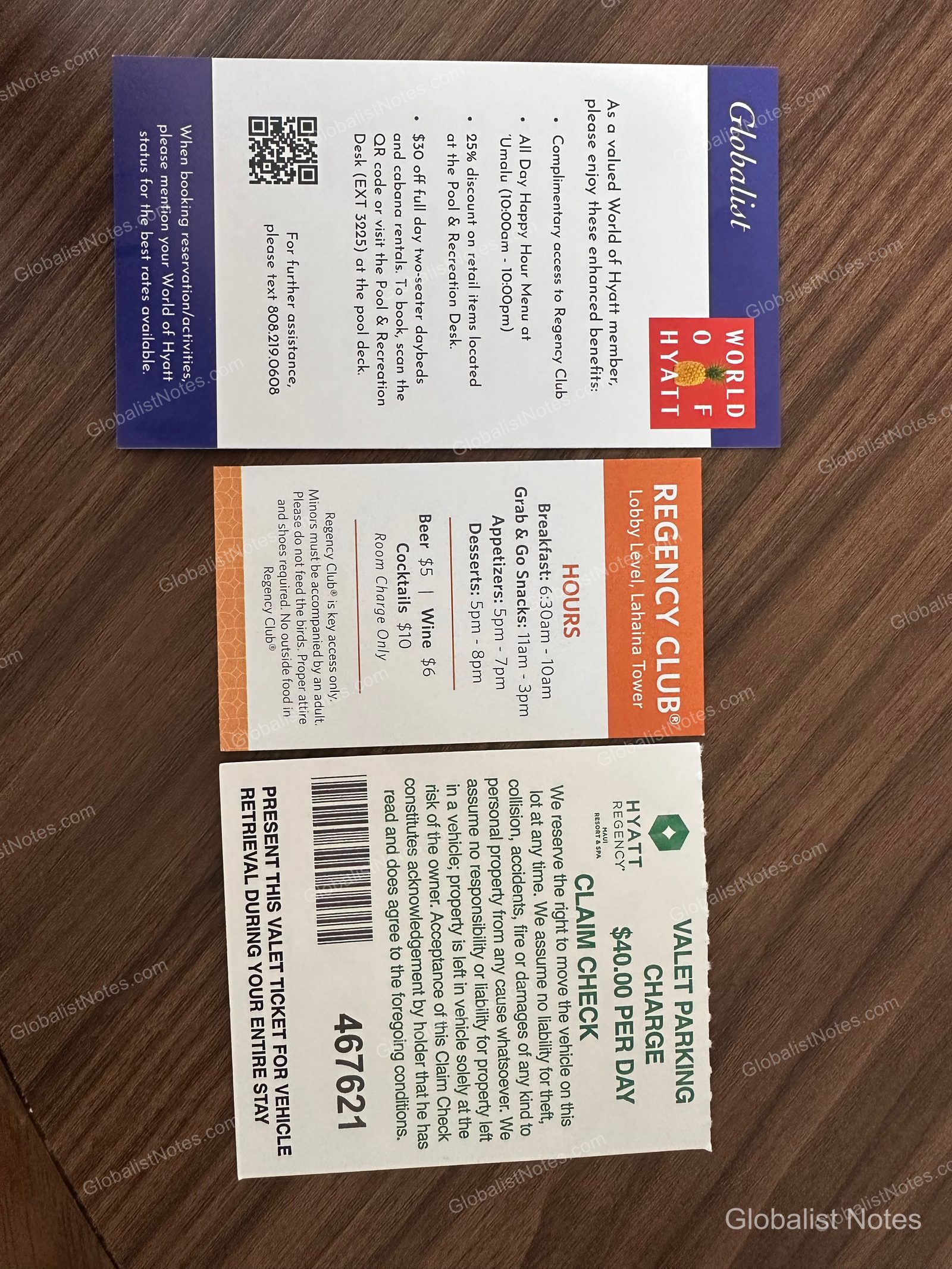 Three information cards provided at Hyatt Regency Maui Resort and Spa. The top card outlines World of Hyatt Globalist benefits, the middle card details Regency Club operating hours and usage policies, and the bottom card shows the $40 per day valet parking fee.