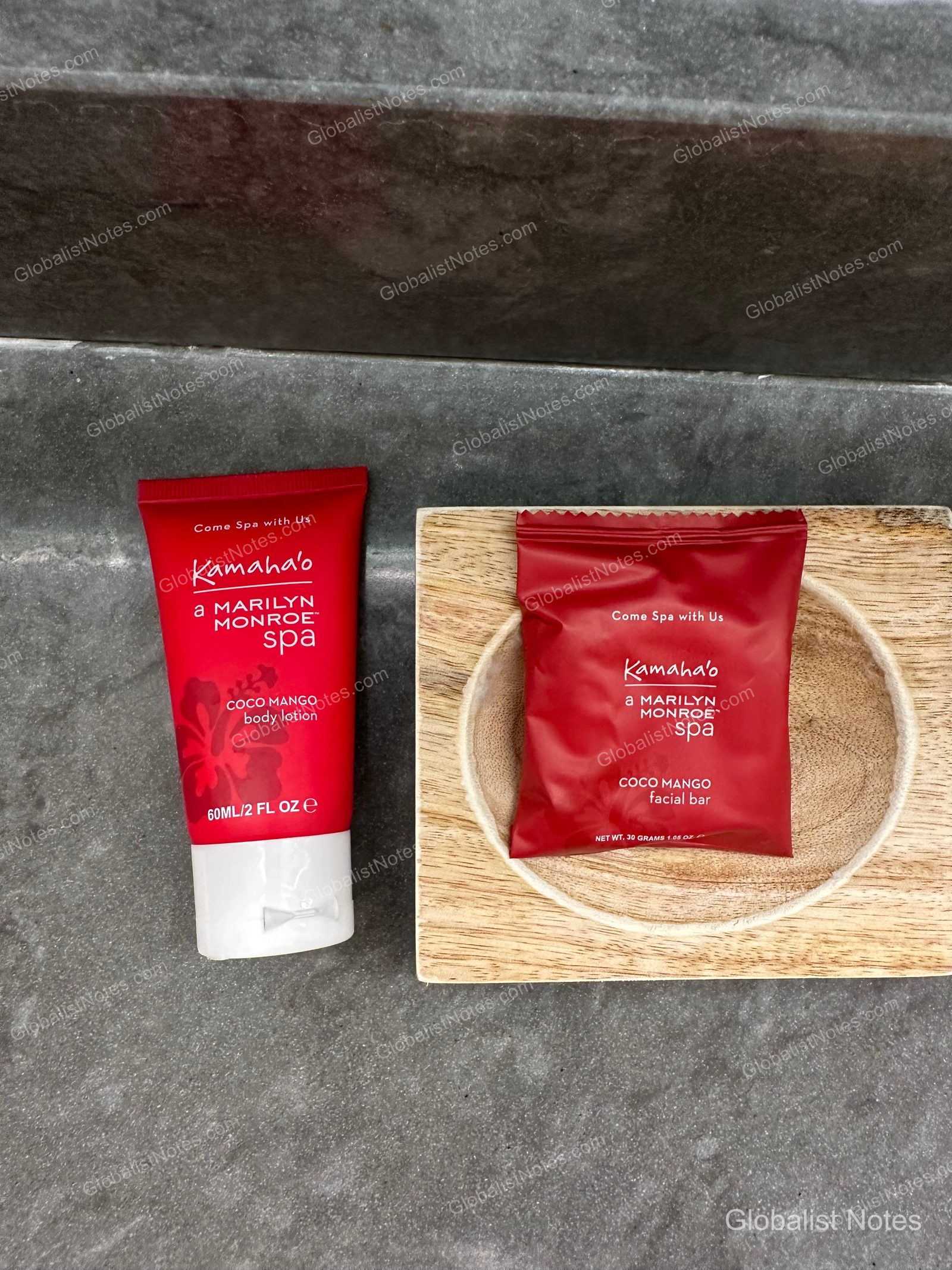 Coco Mango scented body lotion tube and facial bar soap from the Kamaha'o Marilyn Monroe Spa brand placed on a gray marble vanity in a guest room bathroom at Hyatt Regency Maui Resort and Spa in Lahaina, Hawaii.